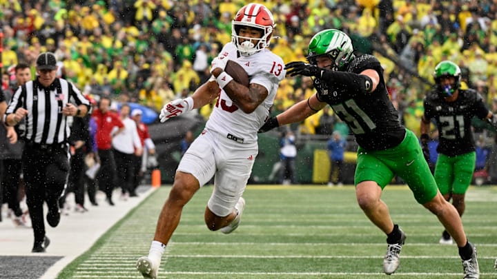 Dillon Thieneman arrives to try and stop Indiana wide receiver Elijah Sarratt after a fourth-quarter catch.