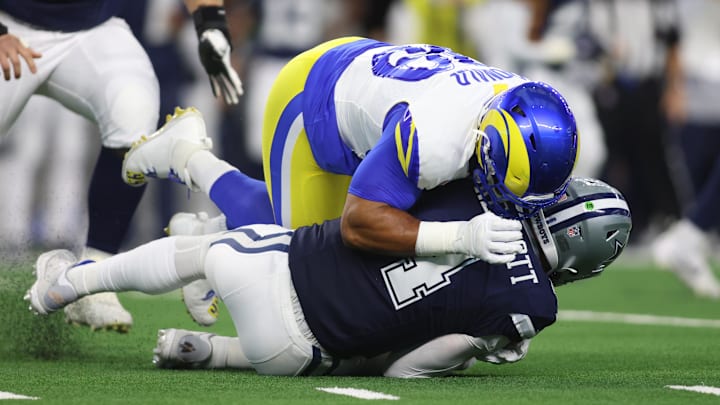Oct 29, 2023; Arlington, Texas, USA; Los Angeles Rams defensive tackle Aaron Donald (99) sacks Dallas Cowboys quarterback Dak Prescott (4) in the first quarter at AT&T Stadium. Mandatory Credit: Tim Heitman-Imagn Images Oct 29, 2023; Arlington, Texas, USA; Los Angeles Rams defensive tackle Aaron Donald (99) sacks Dallas Cowboys quarterback Dak Prescott (4) in the first quarter at AT&T Stadium. Mandatory Credit: Tim Heitman-Imagn Images