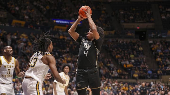 Mar 6, 2026; Morgantown, West Virginia, USA; UCF Knights forward Jamichael Stillwell (4) shoots during the first half against the West Virginia Mountaineers at Hope Coliseum. Mandatory Credit: Ben Queen-Imagn Images Mar 6, 2026; Morgantown, West Virginia, USA; UCF Knights forward Jamichael Stillwell (4) shoots during the first half against the West Virginia Mountaineers at Hope Coliseum. Mandatory Credit: Ben Queen-Imagn Images