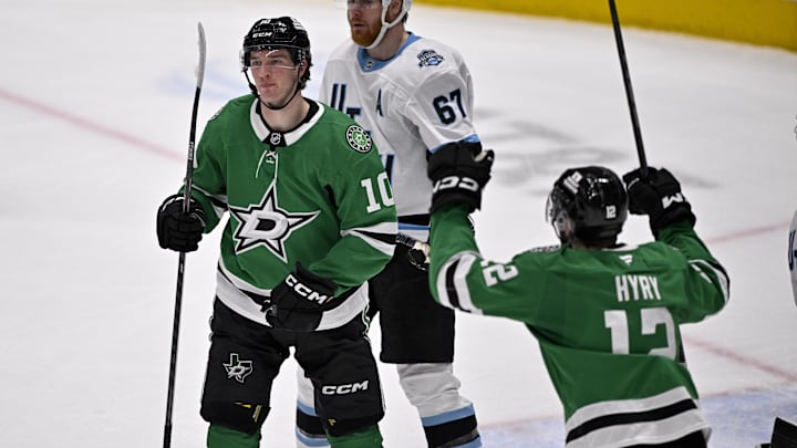 Jan 4, 2025; Dallas, Texas, USA; Dallas Stars center Oskar Back (10) and right wing Arttu Hyry (12) celebrates a goal scored by Back against the Utah Hockey Club during the second period at the American Airlines Center. Mandatory Credit: Jerome Miron-Imagn Images