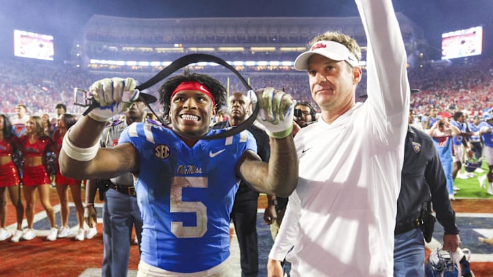 Nov 15, 2025; Oxford, Mississippi, USA; Mississippi Rebels running back Kewan Lacy (5) and head coach Lane Kiffin react after defeating the Florida Gators at Vaught-Hemingway Stadium. Mandatory Credit: Petre Thomas-Imagn Images Nov 15, 2025; Oxford, Mississippi, USA; Mississippi Rebels running back Kewan Lacy (5) and head coach Lane Kiffin react after defeating the Florida Gators at Vaught-Hemingway Stadium. Mandatory Credit: Petre Thomas-Imagn Images
