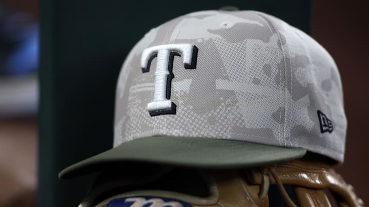 May 18, 2025; Arlington, Texas, USA;  Texas Rangers hat in honor of the military in the dugout  during the second inning against the Houston Astros at Globe Life Field. 