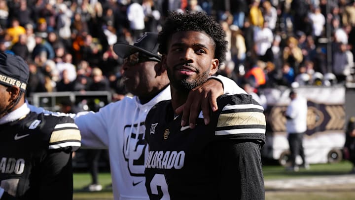 Sanders and his father share a moment on the field following the win over the Oklahoma State Cowboys at Folsom Field. Sanders and his father share a moment on the field following the win over the Oklahoma State Cowboys at Folsom Field.