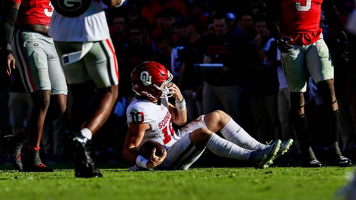 Oklahoma quarterback John Mateer gets tackled against Georgia. Oklahoma quarterback John Mateer gets tackled against Georgia.