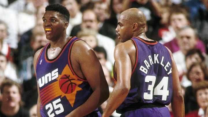 Phoenix Suns forward Charles Barkley (34) talks to Oliver Miller (25) against the Portland Trail Blazers at Memorial Coliseum in 1992.