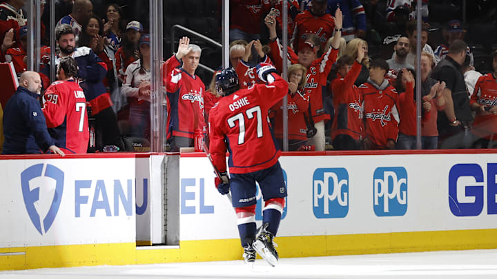 Washington Capitals right wing T.J. Oshie  waves to the fans while leaving the ice
