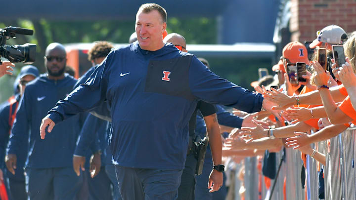 Aug 29, 2025; Champaign, Illinois, USA;  Illinois Fighting Illini head coach Bret Bielema leads his team during the Illini Walk before an NCAA football game against the Western Illinois Leathernecks at Memorial Stadium. Mandatory Credit: Ron Johnson-Imagn Images