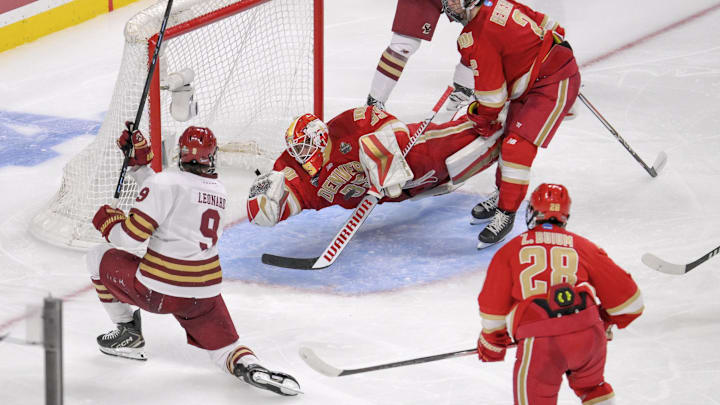 Apr 13, 2024; Saint Paul, Minnesota, USA; Denver Pioneers goalie Matt Davis (35) makes a diving save on Boston College Eagles forward Ryan Leonard (9) during the third period of the championship game of the 2024 Frozen Four college ice hockey tournament at Xcel Energy Center. Mandatory Credit: Nick Wosika-Imagn Images Apr 13, 2024; Saint Paul, Minnesota, USA; Denver Pioneers goalie Matt Davis (35) makes a diving save on Boston College Eagles forward Ryan Leonard (9) during the third period of the championship game of the 2024 Frozen Four college ice hockey tournament at Xcel Energy Center. Mandatory Credit: Nick Wosika-Imagn Images