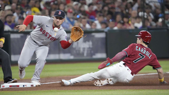Arizona Diamondbacks' Corbin Carroll (7) steals third base as Boston Red Sox third baseman Alex Bregman (2) fields the throw during the fourth inning at Chase Field on Sept. 7, 2025. Arizona Diamondbacks' Corbin Carroll (7) steals third base as Boston Red Sox third baseman Alex Bregman (2) fields the throw during the fourth inning at Chase Field on Sept. 7, 2025.