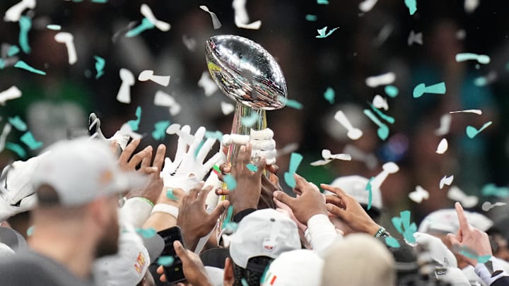 Feb 9, 2025; New Orleans, LA, USA; The Philadelphia Eagles hoist the Vince Lombardi Trophy after defeating the Kansas City Chiefs in Super Bowl LIX at Ceasars Superdome. Mandatory Credit: Kirby Lee-Imagn Images
