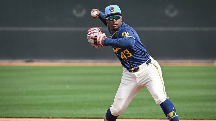 Milwaukee Brewers infield prospect Luis Pena throws to first in a double-play drill during spring training workouts Sunday, February 15, 2026, at American Family Fields of Phoenix in Phoenix, Arizona. Milwaukee Brewers infield prospect Luis Pena throws to first in a double-play drill during spring training workouts Sunday, February 15, 2026, at American Family Fields of Phoenix in Phoenix, Arizona.