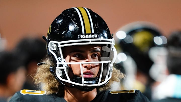 Oct 20, 2023; Carrollton, GA, USA; Carrollton Trojans quarterback Julian Lewis (10) watches on from the sidelines against the Westlake Lions during the first half at Grisham Stadium. The 15-year-old Carrollton High student has already committed to playing for the University of Southern California Trojans and has been considered one of the top high school quarterback prospects. Mandatory Credit: John David Mercer-Imagn Images