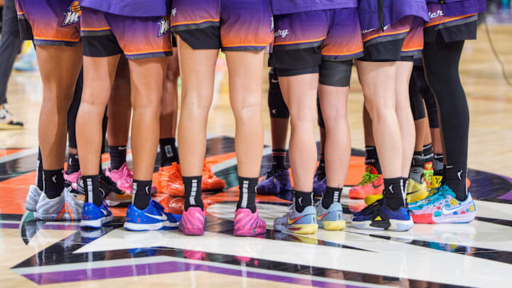 Sep 14, 2025; Phoenix, Arizona, USA; A detailed view as the Phoenix Mercury huddle at mid-court after a loss in overtime to the New York Liberty during game one of the 2025 WNBA Playoffs round one at PHX Arena. Mandatory Credit: Allan Henry-Imagn Images