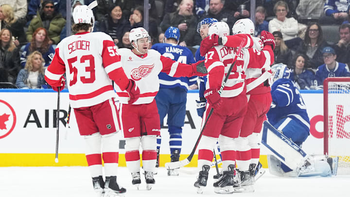 Apr 13, 2024; Toronto, Ontario, CAN; Detroit Red Wings right wing Alex DeBrincat (93) scores a goal and celebrates with Detroit Red Wings defenseman Moritz Seider (53) against the Toronto Maple Leafs during the first period at Scotiabank Arena. Mandatory Credit: Nick Turchiaro-USA TODAY Sports