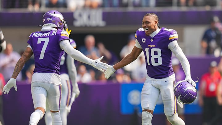 Sep 15, 2024; Minneapolis, Minnesota, USA; Minnesota Vikings wide receiver Justin Jefferson (18) celebrates an interception with cornerback Byron Murphy Jr. (7) against the San Francisco 49ers in the third quarter at U.S. Bank Stadium. Sep 15, 2024; Minneapolis, Minnesota, USA; Minnesota Vikings wide receiver Justin Jefferson (18) celebrates an interception with cornerback Byron Murphy Jr. (7) against the San Francisco 49ers in the third quarter at U.S. Bank Stadium.