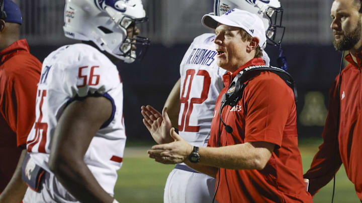 Sep 19, 2024; Boone, North Carolina, USA;  South Alabama Jaguars head coach Major Applewhite claps after a score as South Alabama Jaguars offensive lineman Adrian Griffin (56) and tight end Trent Thomas (82) return to the bench during the second half against the Appalachian State Mountaineers at Kidd Brewer Stadium. Mandatory Credit: Reinhold Matay-Imagn Images