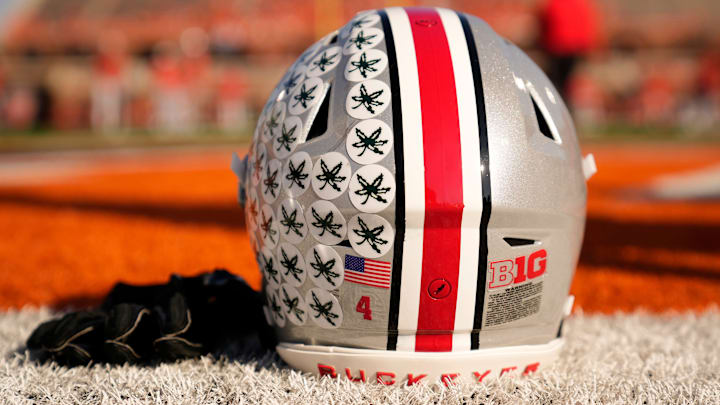 Ohio State Buckeyes wide receiver Jeremiah Smith's helmet sits on the sideline as the team warms up prior to the NCAA football game against the Illinois Fighting Illini at Gies Memorial Stadium in Champaign on Oct. 11, 2025.