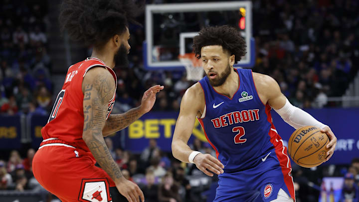 Feb 2, 2025; Detroit, Michigan, USA; Detroit Pistons guard Cade Cunningham (2) dribbles defended by Chicago Bulls guard Coby White (0) in the second half at Little Caesars Arena. Mandatory Credit: Rick Osentoski-Imagn Images