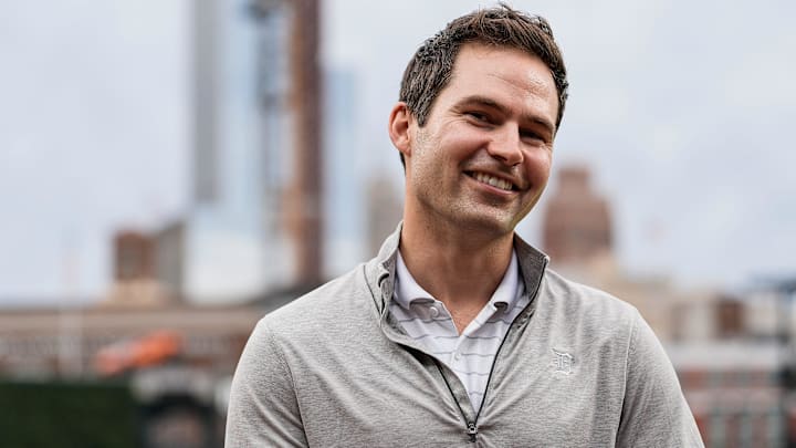 Detroit Tigers president of baseball operations Scott Harris talks to a TV reporter before a game against Chicago White Sox at Comerica Park in Detroit on Friday, Sept. 27, 2024