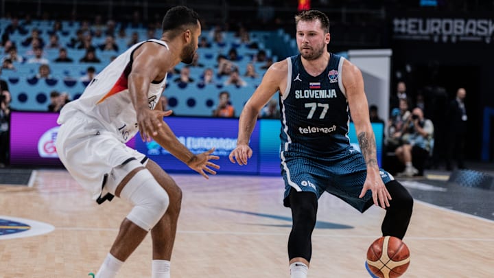 Luka Doncic (R) of Slovenia and Johannes Thiemann (L) seen...