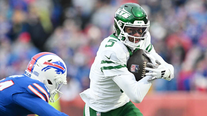 Dec 29, 2024; Orchard Park, New York, USA; New York Jets wide receiver Garrett Wilson (5) tries to get past Buffalo Bills safety Cole Bishop (24) after making a catch in the second quarter at Highmark Stadium. Mandatory Credit: Mark Konezny-Imagn Images Dec 29, 2024; Orchard Park, New York, USA; New York Jets wide receiver Garrett Wilson (5) tries to get past Buffalo Bills safety Cole Bishop (24) after making a catch in the second quarter at Highmark Stadium. Mandatory Credit: Mark Konezny-Imagn Images