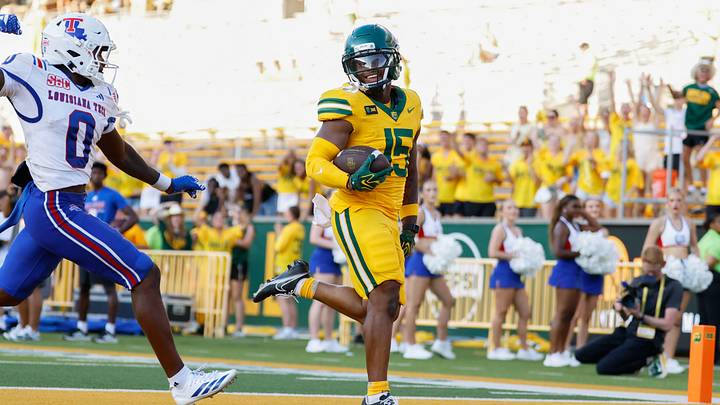 Sep 19, 2026; Waco, Texas, USA; Baylor Bears wide receiver Jayden McGowan (15) scores a touchdown ahead of Louisiana Tech Bulldogs defensive back Jordan McRae (0) during the second half at McLane Stadium. Mandatory Credit: Chris Jones-Imagn Images Sep 19, 2026; Waco, Texas, USA; Baylor Bears wide receiver Jayden McGowan (15) scores a touchdown ahead of Louisiana Tech Bulldogs defensive back Jordan McRae (0) during the second half at McLane Stadium. Mandatory Credit: Chris Jones-Imagn Images