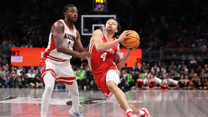 Mar 14, 2026; Kansas City, MO, USA; Houston Cougars guard Kingston Flemings (4) drives to the hoop past Arizona Wildcats guard Jaden Bradley (0) during the second half during the men's Big 12 Conference Tournament Championship at T-Mobile Center. Mandatory Credit: William Purnell-Imagn Images Mar 14, 2026; Kansas City, MO, USA; Houston Cougars guard Kingston Flemings (4) drives to the hoop past Arizona Wildcats guard Jaden Bradley (0) during the second half during the men's Big 12 Conference Tournament Championship at T-Mobile Center. Mandatory Credit: William Purnell-Imagn Images