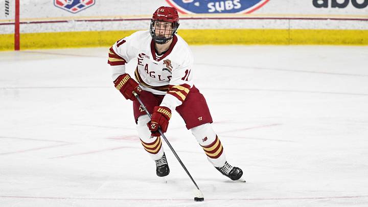 Feb 28, 2025; Chestnut Hill, MA, USA; Boston College defenseman Michael Hagens (11) skates with the puck against the University of New Hampshire Wildcats during the second period at Conte Forum. Mandatory Credit: Eric Canha-Imagn Images