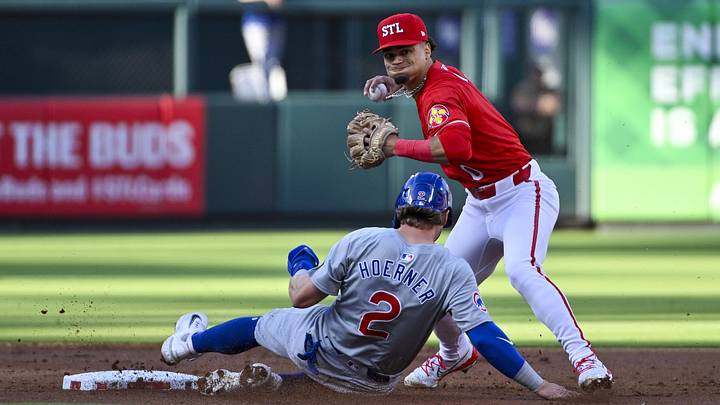 May 25, 2024; St. Louis, Missouri, USA; St. Louis Cardinals shortstop Masyn Winn (0) forces out Chicago Cubs second baseman Nico Hoerner (2) and throws to first to complete the double play during the second inning at Busch Stadium. Mandatory Credit: Jeff Curry-Imagn Images May 25, 2024; St. Louis, Missouri, USA; St. Louis Cardinals shortstop Masyn Winn (0) forces out Chicago Cubs second baseman Nico Hoerner (2) and throws to first to complete the double play during the second inning at Busch Stadium. Mandatory Credit: Jeff Curry-Imagn Images