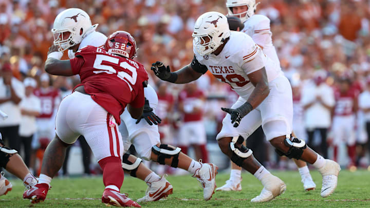 Oct 12, 2024; Dallas, Texas, USA;  Texas Longhorns offensive lineman Kelvin Banks Jr. (78) looks to block Oklahoma Sooners defensive lineman Damonic Williams (52) during the game at the Cotton Bowl. Mandatory Credit: Kevin Jairaj-Imagn Images