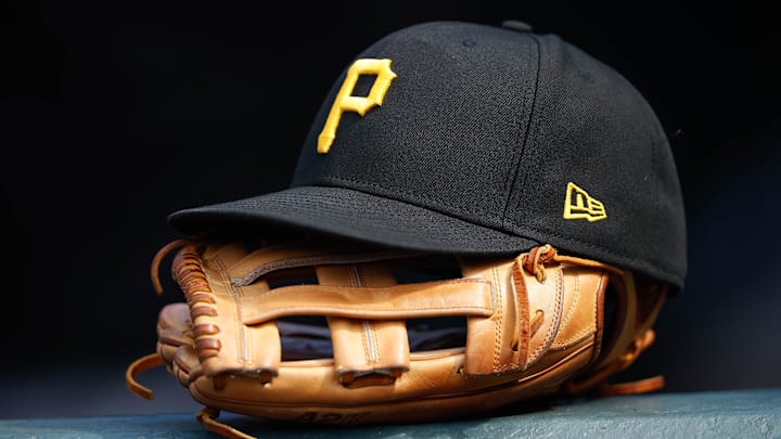 A general view of a Pittsburgh Pirates glove and hat in the eighth inning against the Colorado Rockies at Coors Field. 