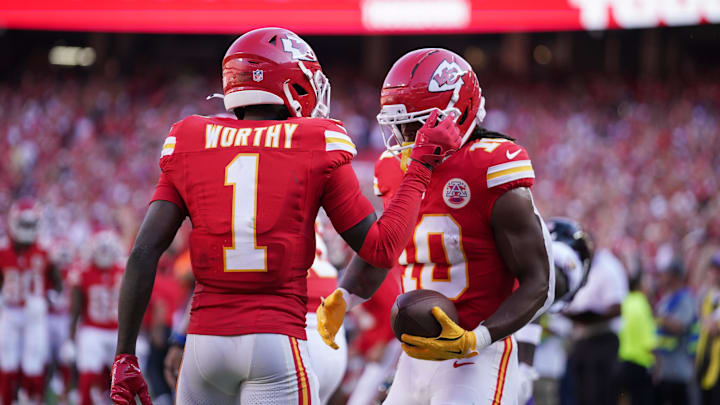 Sep 28, 2025; Kansas City, Missouri, USA;  Kansas City Chiefs running back Isiah Pacheco (10) celebrates with Kansas City Chiefs wide receiver Xavier Worthy (1) after scoring a touchdown during the second quarter against the Baltimore Ravens at GEHA Field at Arrowhead Stadium. Mandatory Credit: Denny Medley-Imagn Images