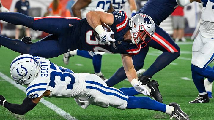 Aug 13, 2026; Foxborough, Massachusetts, USA; Indianapolis Colts safety Daniel Scott (32) tackles New England Patriots running back Lan Larison (34) during the second half at Gillette Stadium. Mandatory Credit: Eric Canha-Imagn Images