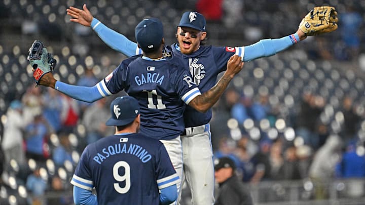 Apr 5, 2024; Kansas City, Missouri, USA; Kansas City Royals shortstop Bobby Witt Jr. (7), Maikel Garcia (11) and Vinnie Pasquantino (9) celebrate after beating the Chicago White Sox at Kauffman Stadium. Mandatory Credit: Peter Aiken-Imagn Images