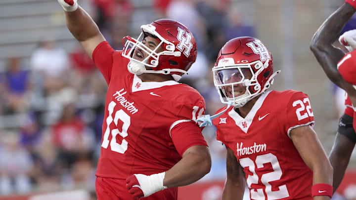 Aug 28, 2025; Houston, Texas, USA; Houston Cougars defensive lineman Khalil Laufau (18) celebrates with defensive back Marc Stampley II (22) after a defenisve play during the first quarter against the Stephen F. Austin Lumberjacks at TDECU Stadium. Mandatory Credit: Troy Taormina-Imagn Images Aug 28, 2025; Houston, Texas, USA; Houston Cougars defensive lineman Khalil Laufau (18) celebrates with defensive back Marc Stampley II (22) after a defenisve play during the first quarter against the Stephen F. Austin Lumberjacks at TDECU Stadium. Mandatory Credit: Troy Taormina-Imagn Images