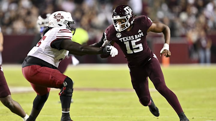 Nov 16, 2024; College Station, Texas, USA; Texas A&M Aggies defensive lineman Rylan Kennedy (15) runs around the edge against the New Mexico State Aggies during the first half at Kyle Field. Mandatory Credit: Maria Lysaker-Imagn Images 