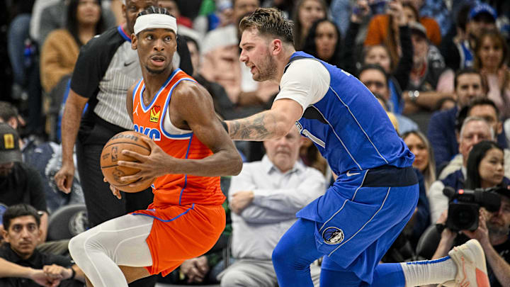 Dec 2, 2023; Dallas, Texas, USA; Oklahoma City Thunder guard Shai Gilgeous-Alexander (2) and Dallas Mavericks guard Luka Doncic (77) in action during the game between the Dallas Mavericks and the Oklahoma City Thunder at the American Airlines Center. Mandatory Credit: Jerome Miron-Imagn Images