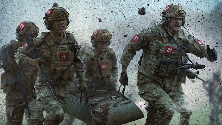 (L-R) Richard Cotta as 13, Yuchen Wang as 111, Heather Burridge as 122, and Alan Ritchson as 81 in War Machine