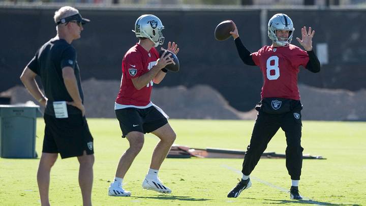 Jun 9, 2026; Henderson, NV, USA; Las Vegas Raiders quarterbacks Fernando Mendoza (15) and Kirk Cousins (8) throw the ball as assistant head coach Mike McCoy (left) watches during minicamp at Intermountain Health Performance Center. Mandatory Credit: Kirby Lee-Imagn Images Jun 9, 2026; Henderson, NV, USA; Las Vegas Raiders quarterbacks Fernando Mendoza (15) and Kirk Cousins (8) throw the ball as assistant head coach Mike McCoy (left) watches during minicamp at Intermountain Health Performance Center. Mandatory Credit: Kirby Lee-Imagn Images
