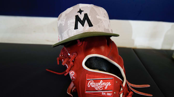 May 16, 2025; Milwaukee, Wisconsin, USA;  General view of a Minnesota Twins military-inspired baseball cap in the dugout prior to the game against the Milwaukee Brewers at American Family Field.