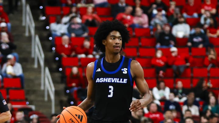 Dec 6, 2025; Raleigh, North Carolina, USA; UNC Asheville Bulldogs guard Kameron Taylor (3) dribbles down the court during the second half of the game against NC State Wolfpack at Lenovo Center. Mandatory Credit: Jaylynn Nash-Imagn Images Dec 6, 2025; Raleigh, North Carolina, USA; UNC Asheville Bulldogs guard Kameron Taylor (3) dribbles down the court during the second half of the game against NC State Wolfpack at Lenovo Center. Mandatory Credit: Jaylynn Nash-Imagn Images