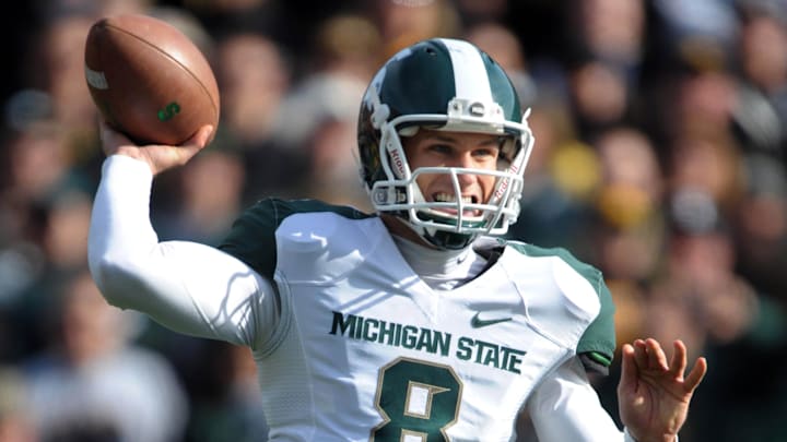Nov 12, 2011; Iowa City, IA, USA; Michigan State Spartans quarterback Kirk Cousins (8) throws a pass against the Iowa Hawkeyes at Kinnick Stadium. Mandatory Credit: Kirby Lee/Image of Sport-Imagn Images