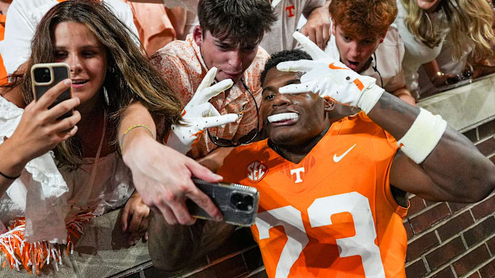 Tennessee defensive back Boo Carter (23) takes a selfie with fans during a SEC conference game between Tennessee and Florida in Neyland Stadium on Saturday, Oct. 12, 2024.
