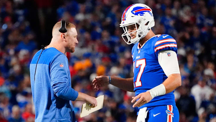 Buffalo Bills quarterbacks coach Joe Brady speaks with Buffalo Bills quarterback Josh Allen (17) at a timeout during the first half against the Tennessee Titans at Highmark Stadium.