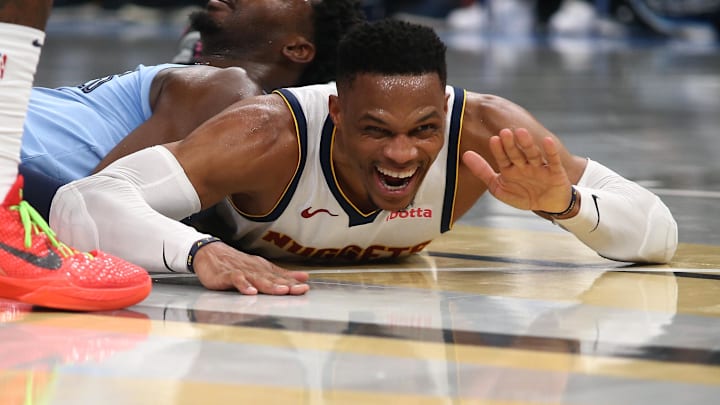 Denver Nuggets guard Russell Westbrook (4) reacts as he lays on the court during the second half against the Memphis Grizzlies at FedExForum. Mandatory Credit: Petre Thomas-Imagn Images