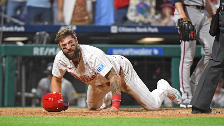 Philadelphia, Pennsylvania, USA; Philadelphia Phillies outfielder Weston Wilson (37) reacts after sliding safely into home plate against the Atlanta Braves during the seventh inning at Citizens Bank Park.