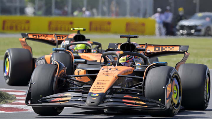 Jun 15, 2025; Montreal, Quebec, Canada; Haas driver Esteban Ocon (31)  races ahead of McLaren driver Lando Norris (4) during the F1 Montreal Grand Prix at Circuit Gilles-Villeneuve. Mandatory Credit: Eric Bolte-Imagn Images