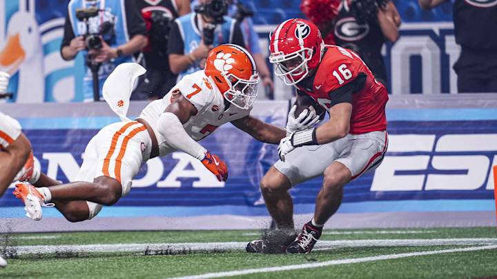 Aug 31, 2024; Atlanta, Georgia, USA; Georgia Bulldogs wide receiver London Humphreys (16) scores a touchdown past Clemson Tigers safety Khalil Barnes (7) during the second half at Mercedes-Benz Stadium. Mandatory Credit: Dale Zanine-Imagn Images Aug 31, 2024; Atlanta, Georgia, USA; Georgia Bulldogs wide receiver London Humphreys (16) scores a touchdown past Clemson Tigers safety Khalil Barnes (7) during the second half at Mercedes-Benz Stadium. Mandatory Credit: Dale Zanine-Imagn Images