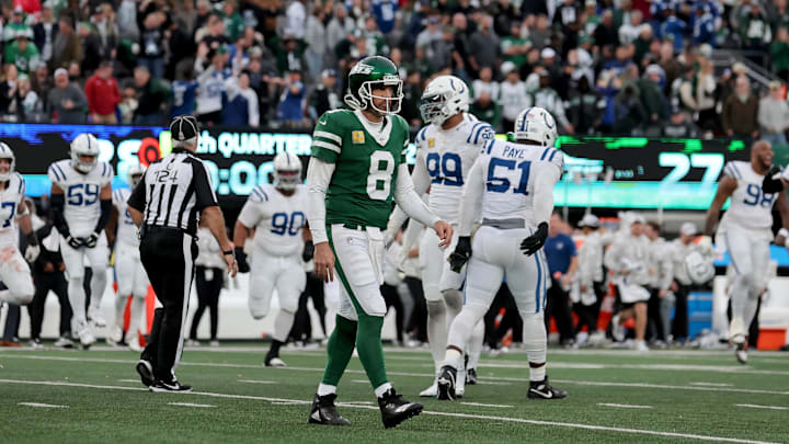 Rodgers walks off the field after losing to the Colts.