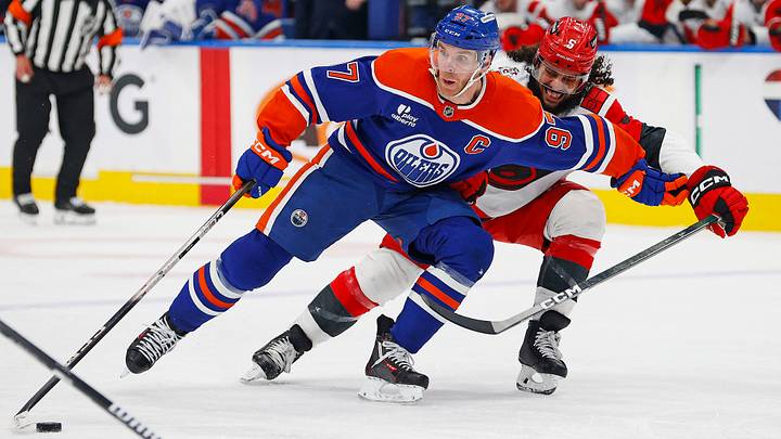 Mar 6, 2026; Edmonton, Alberta, CAN; Edmonton Oilers forward Connor McDavid (97) protects the puck from Carolina Hurricanes defensemen Jalen Chatfield (5) during the third period at Rogers Place. Mandatory Credit: Perry Nelson-Imagn Images Mar 6, 2026; Edmonton, Alberta, CAN; Edmonton Oilers forward Connor McDavid (97) protects the puck from Carolina Hurricanes defensemen Jalen Chatfield (5) during the third period at Rogers Place. Mandatory Credit: Perry Nelson-Imagn Images